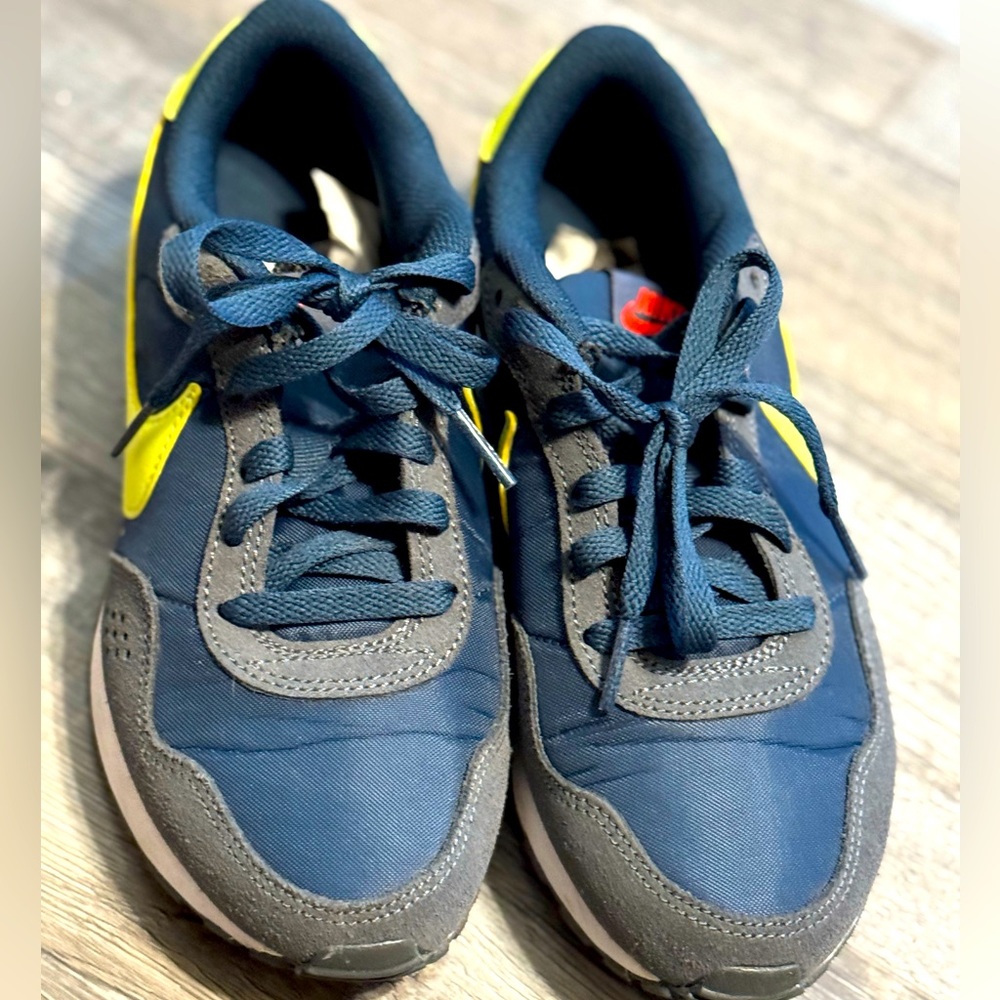 Blue and Neon yellow Nike in like new condition.